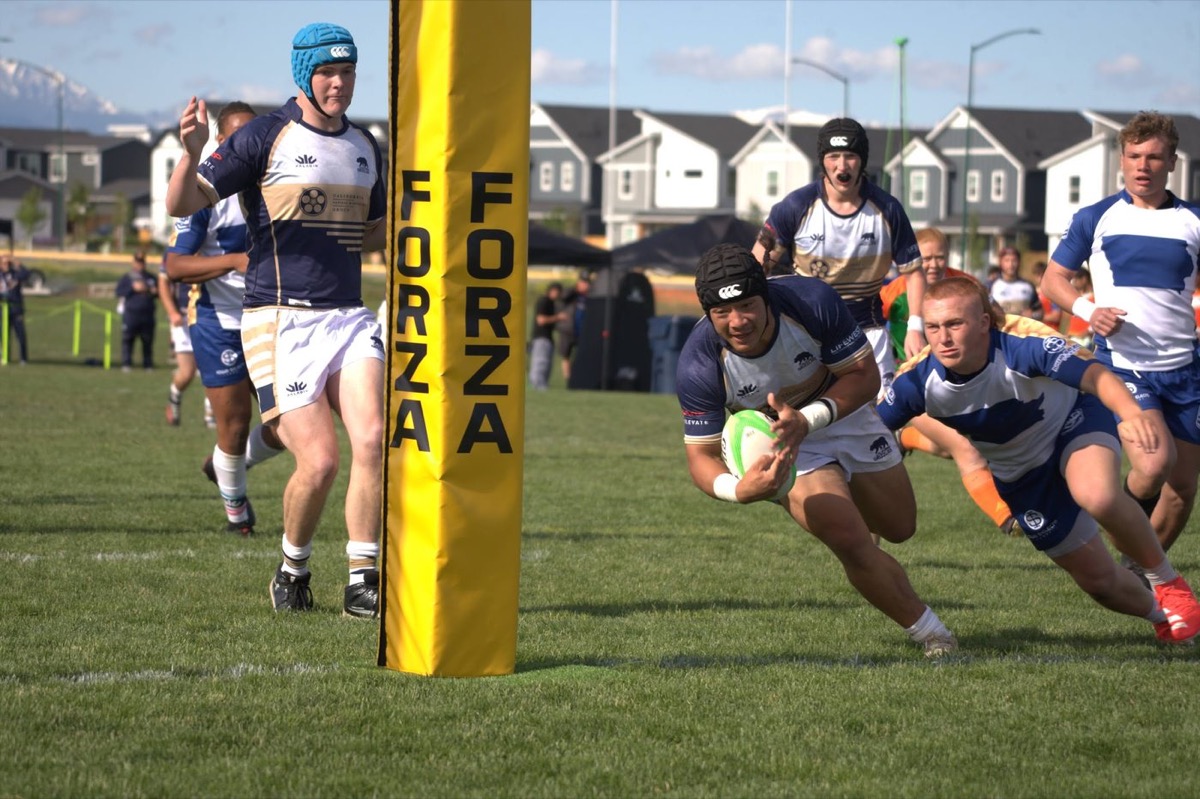 Player diving over the line for a try at a Montana youth rugby tournament