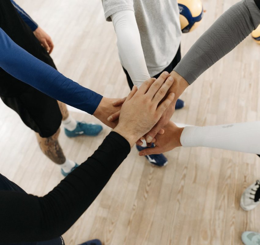 Team huddle, hands stacked together